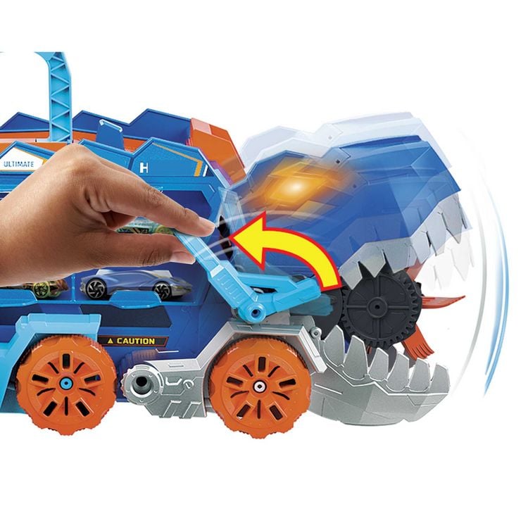 Produktbild: Der Hot Wheels City Ultimative Transporter verwandelt sich in einen T-Rex mit Rennstrecke, Aufbewahrung von mehr als 20 Autos