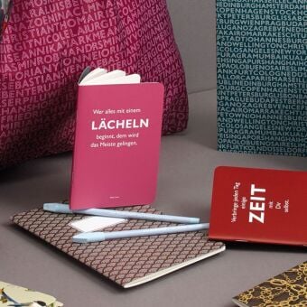 Produktbild: Heft A6 kariert, "Wer alles mit einem L&auml;cheln beginnt, dem wird das Meiste gelingen." (Dalai Lama)