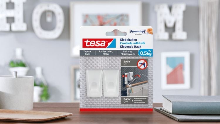 Produktbild: Tesa Klebehaken Tapeten & Putz - selbstklebender Haken - ideal zur Befestigung von Girlanden & Lichterketten - h&auml;lt bis zu