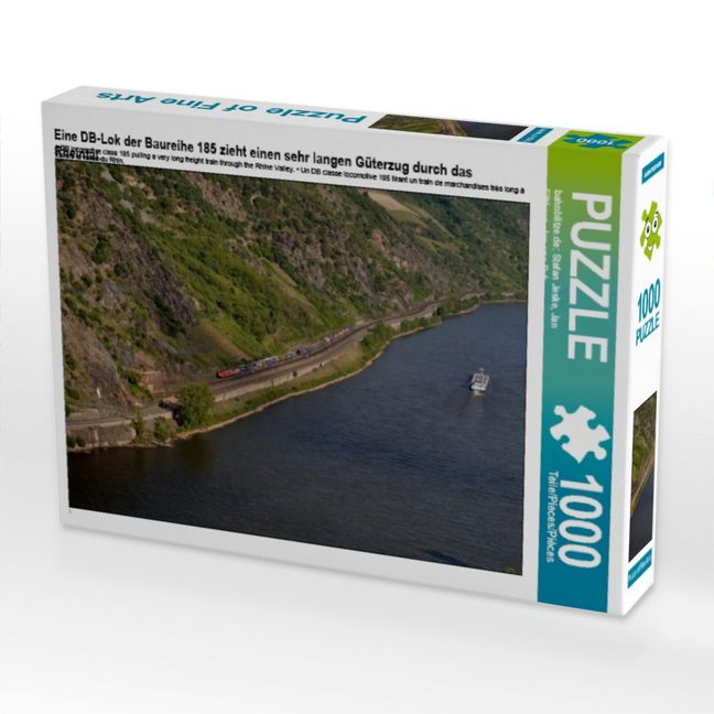 Produktbild: Eine DB-Lok der Baureihe 185 zieht einen sehr langen G&uuml;terzug durch das Rheintal. (Puzzle)