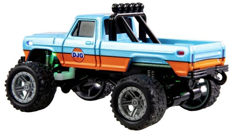 Produktbild: Amewi Orange Brushed 1:64 RC Modellauto Elektro Monstertruck Heckantrieb (2WD) RtR 2,4 GHz mit Lichteffekt, inkl. Akku und Ladekabel