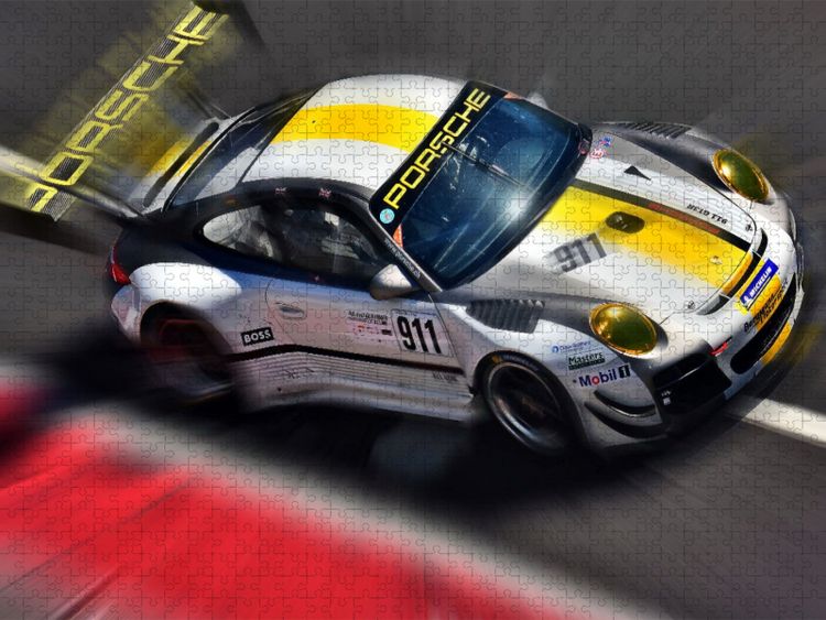 Produktbild: CALVENDO Puzzle Porsche 911 GT3 - der Sportwagen ist in zahllosen Wettbewerben unterwegs. | 1000 Teile Lege-Gr&ouml;&szlig;e 64x48cm Foto-Puzzle f&uuml;r gl&uuml;ckliche S
