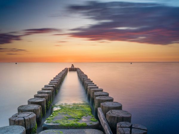 Produktbild: CALVENDO Puzzle Buhnen beim Sonnenuntergang &uuml;ber der Ostsee | 1000 Teile Lege-Gr&ouml;&szlig;e 64x48cm Foto-Puzzle f&uuml;r gl&uuml;ckliche Stunden