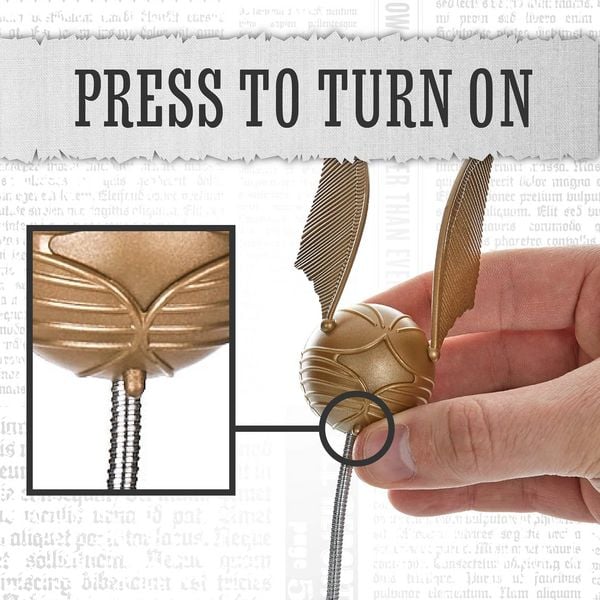 Produktbild: Harry Potter Goldener Snitch Buchlampe mit Clip-Halterung