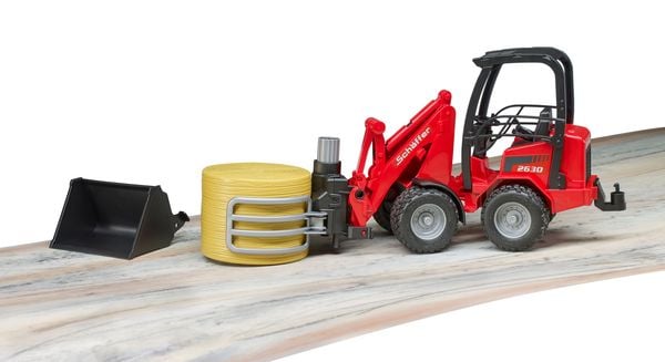 Produktbild: bruder 02192 Sch&auml;ffer Hoflader 2630 mit Ballengreifzange + Rundballen