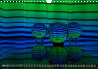 Glaskugeln im Licht - faszinierende Lightpaintings (Wandkalender 2023 DIN A4 quer)